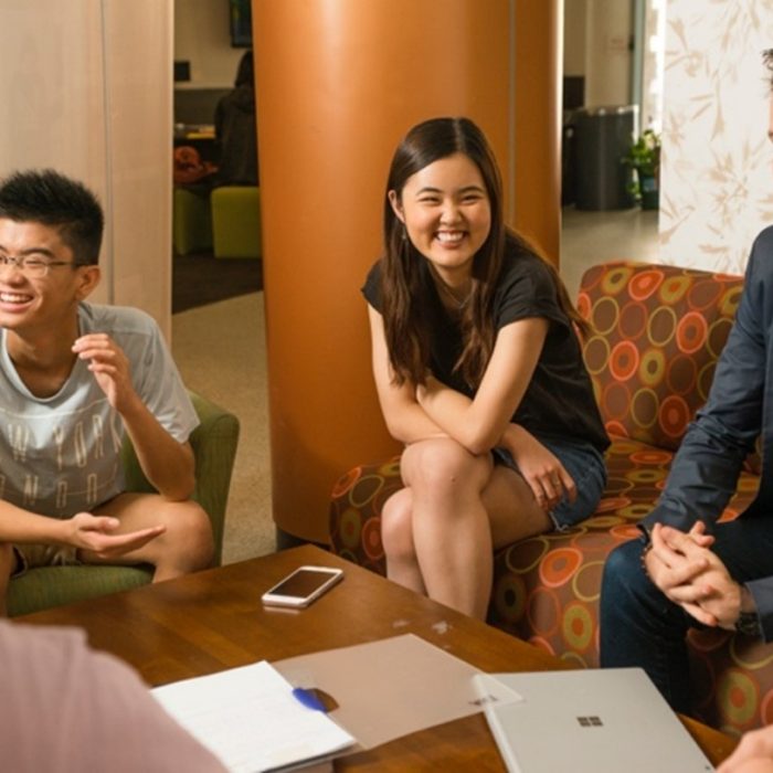 students sitting around a coffee table