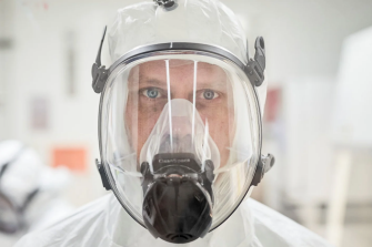 Medconnect image with a scientist with a mask in a lab