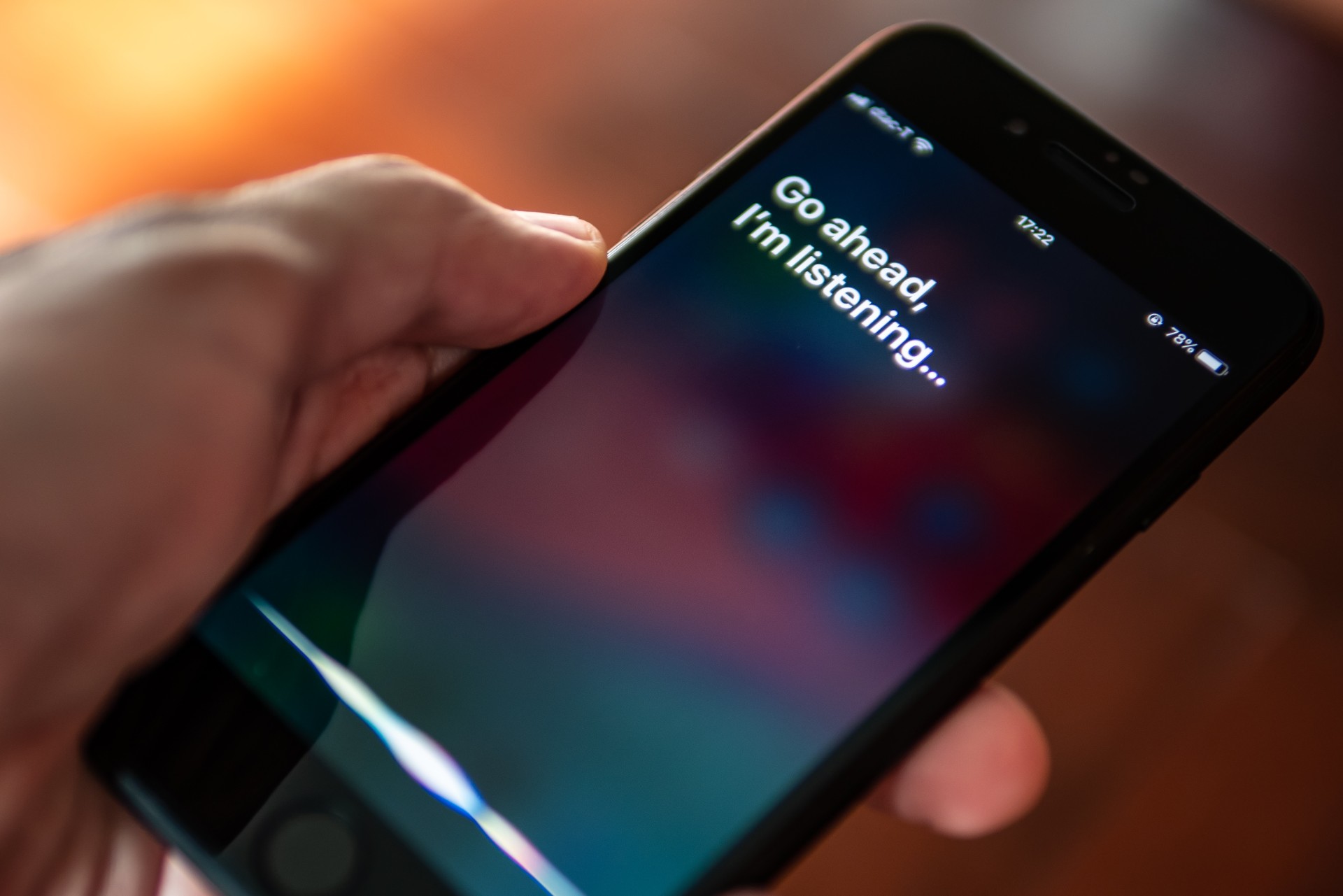 Bangkok, Thailand - July 30, 2019 : Siri, Apple's voice-activated digital assistant, tells iPhone user to ask her by showing the text "Go ahead, I'm listening" on the display.