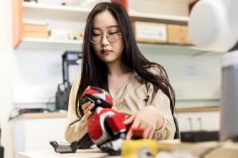 Engineering student working on a robotic dog