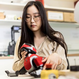 Engineering student working on a robotic dog