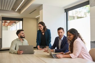 AGSM students working together in a classroom on campus