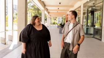 Two people walking at UNSW Business School on campus