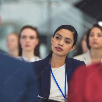 lady at conference taking notes