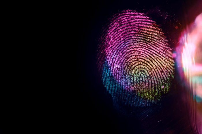 Close up beautiful abstract multi colored fingerprint on  background texture for design. Macro photography view.