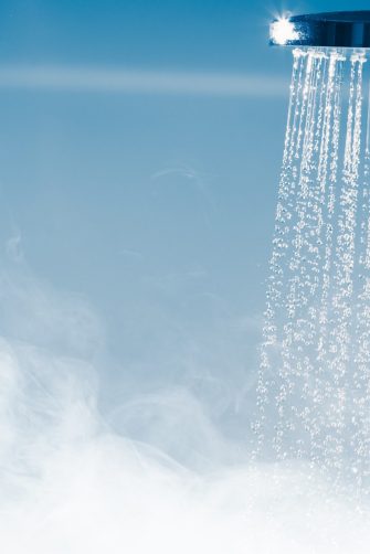 shower with flowing water and steam