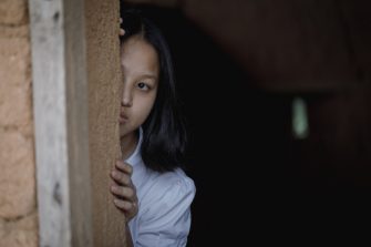 Young girl with eye sad and hopeless. Human trafficking and fear child concept.