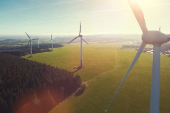 Wind turbines and agricultural fields on a sunny day