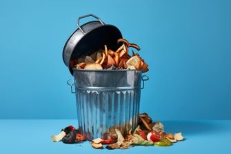 AI-generated image of metallic trash can with leftover food