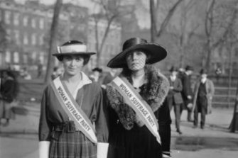 It's 1915 and Rose Cumming and Edith Griffith wear Woman Suffrage Party sashes and look at the camera.