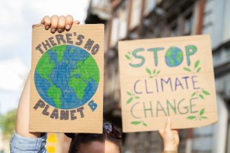 Signs says There's no planet B and Stop Climate Change