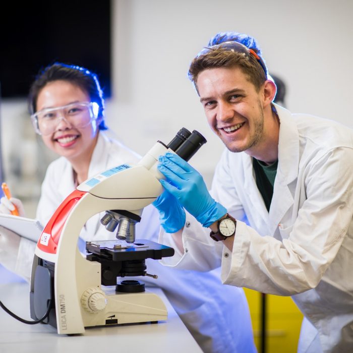 Photograph of students using microscope