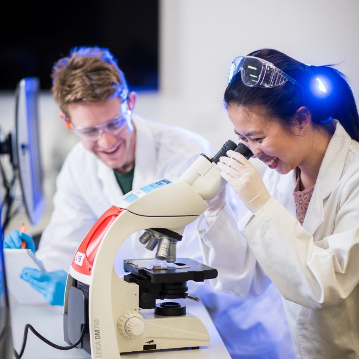 Photograph of students using microscope