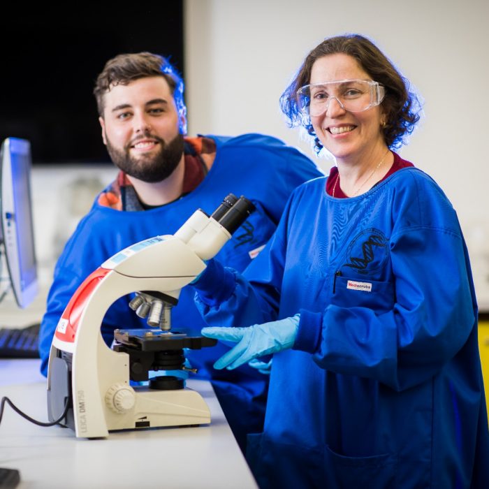 Photograph of students using microscope