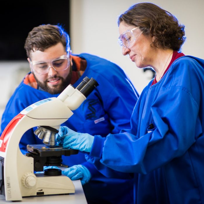 Photograph of students using microscope