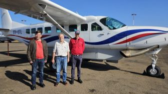 Chris Sanderson, Richard Kingsford, Tom Clark about to embark on light aircraft