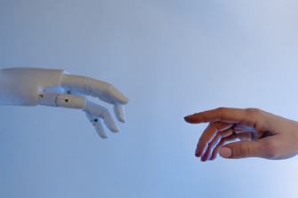 Human and robot touch of hand