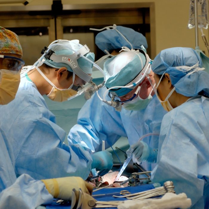 Surgeons in operating theatre