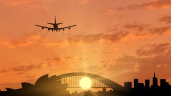 Silhouette of Sydney and the plane coming in to land. tourism and recreation concept