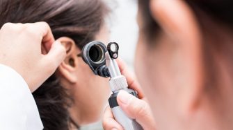 Doctor examined the patient's ear with Otoscope. Patient seem to have problems with hearing.