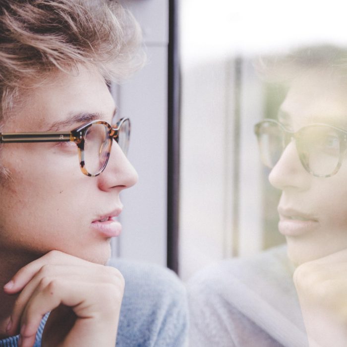 Man looking out of window