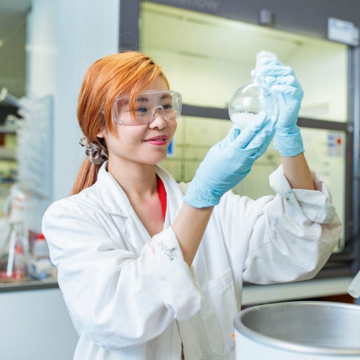 A female student working in a chemistry lab