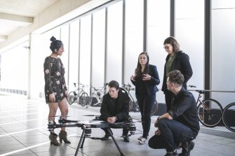 Founder short course, posing in front of drone