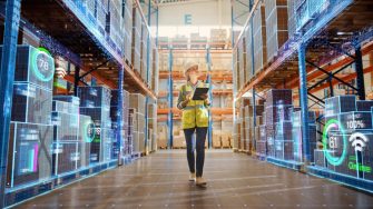 Futuristic Technology Retail Warehouse: Worker Doing Inventory Walks when Digitalization Process Analyzes Goods, Cardboard Boxes, Products with Delivery Infographics in Logistics, Distribution Center