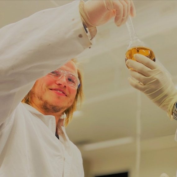 two scientists with flask