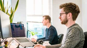 Men working at computers