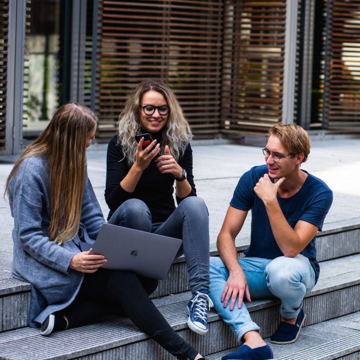 Students sitting on steps talking