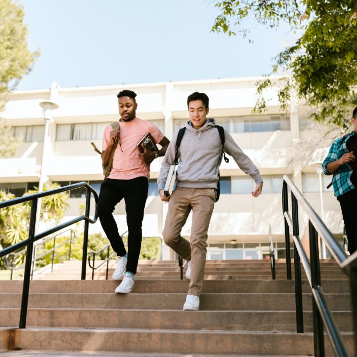 Students running down stairs