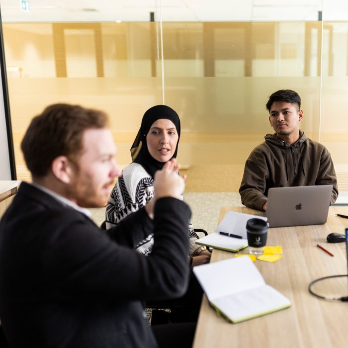 uDASH Staff collaborating in Boardroom