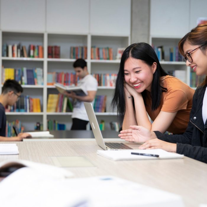 Students studying with books and laptops in the Library Support Unit (LSU)