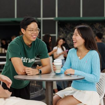 Students talking with coffee at a table