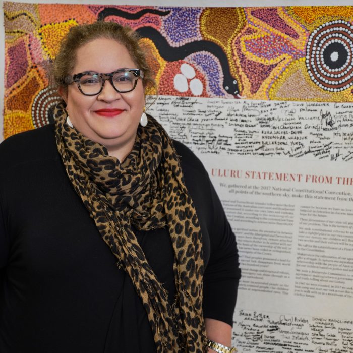 Magan Davis stands in front of The Statement from the heart document