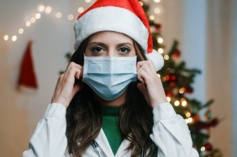 Doctor With mask on Christmas Background