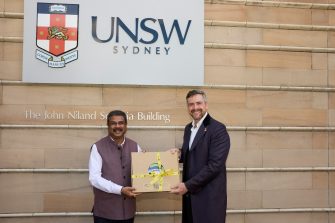 Education Minister of India standing with the UNSW Vice-Chancellor