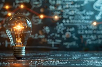 This image depicts a glowing light bulb symbolizing the spark of innovation and the creative process that drives invention The chalkboard background suggests a learning environment