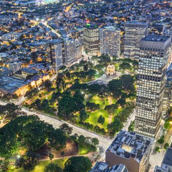 Elevated view of Hyde Park with Anzac War Memorial at dusk, Sydney, NSW, Australia