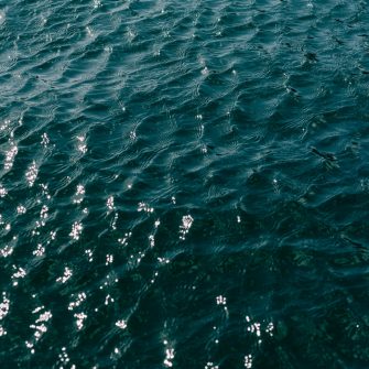 Blue lake water with waves