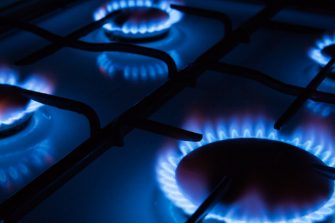 Blue flames of gas burning from a kitchen gas stove