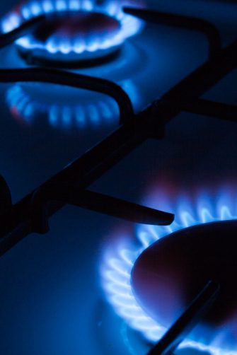 Blue flames of gas burning from a kitchen gas stove