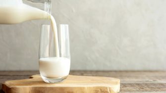 Photo of fresh milk being poured into glass