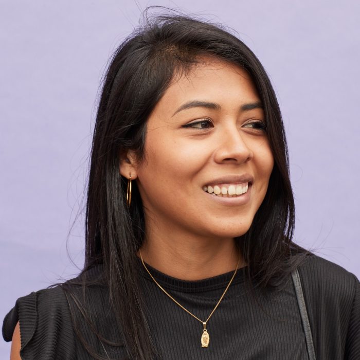 Happy student on coloured background