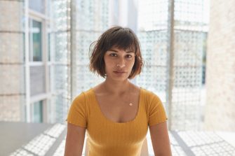 Portrait of female student in a yellow shirt.