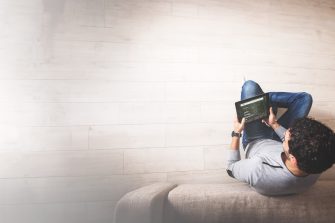 Photo of person from above browsing UNSW website on a tablet