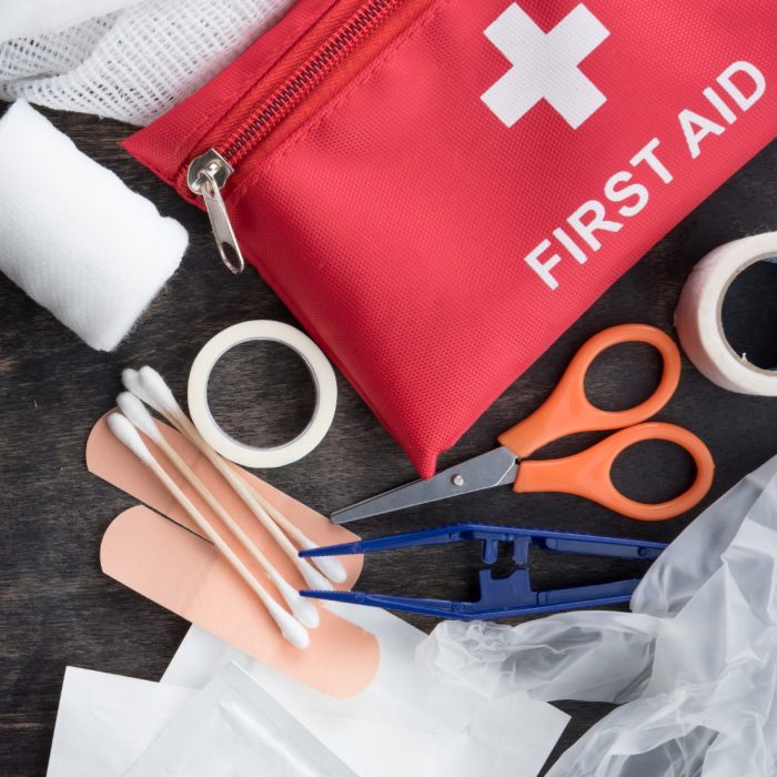 First aid medical kit on wood background,copy space,top view