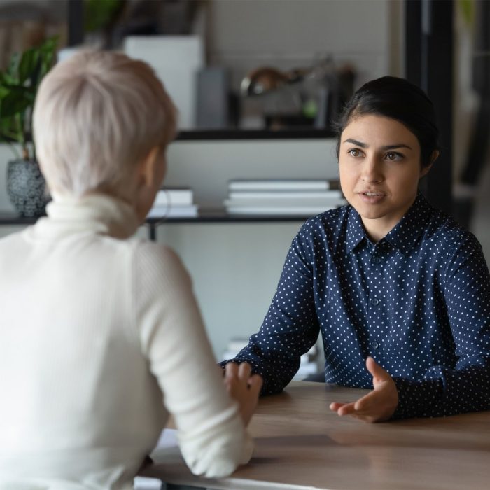 Photo of two people having a serious conversation