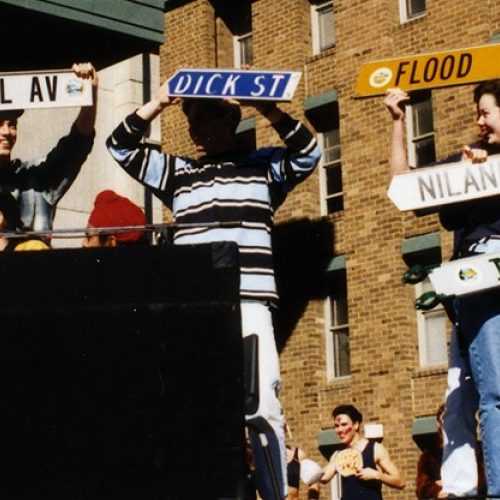 Students with street name signs